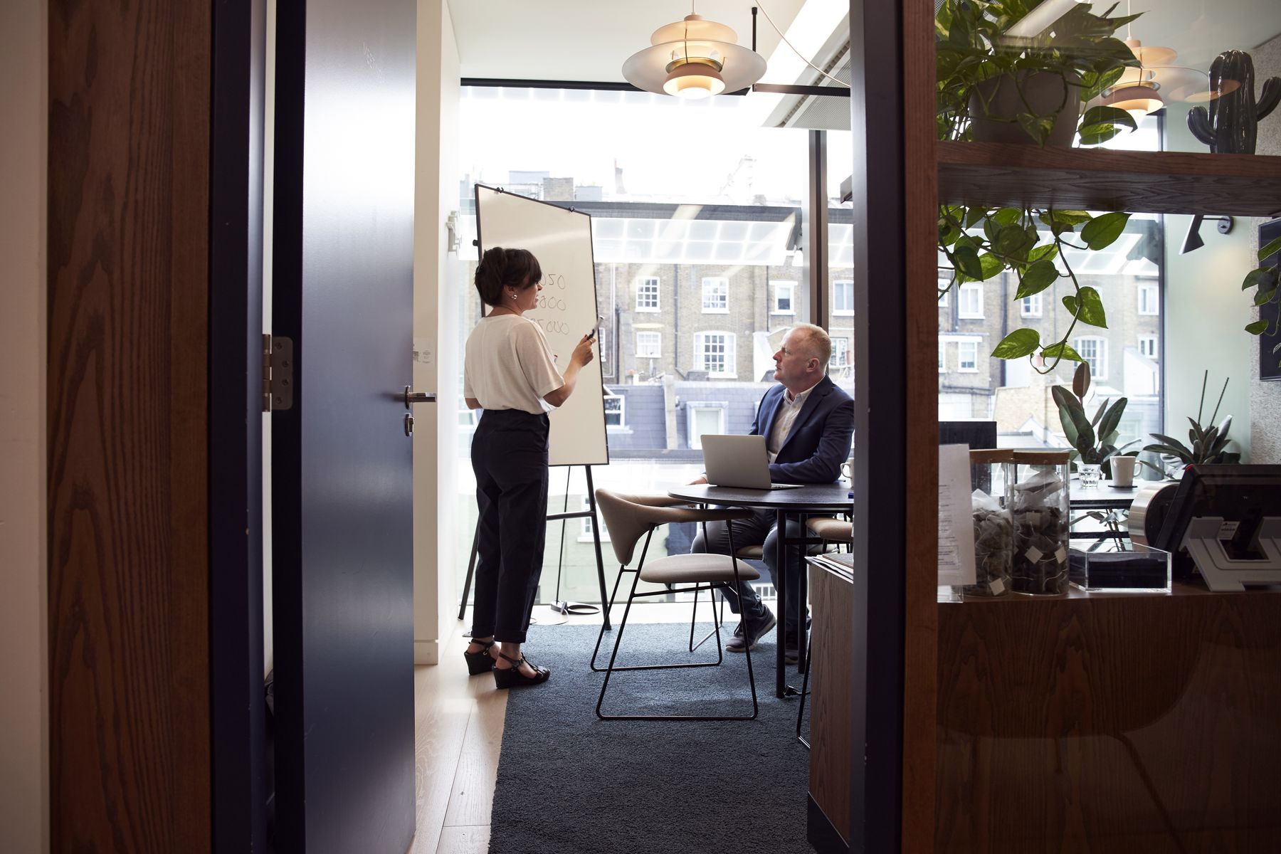 ElvoraRemote recruitment team discussing applications in a London office